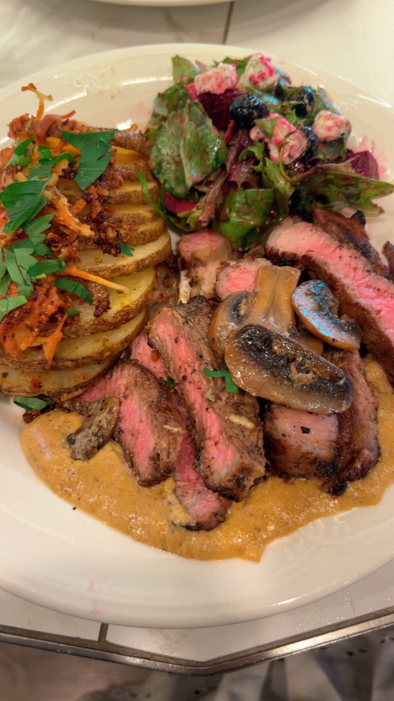 Black Angus NY Strip — plated meal, full spread